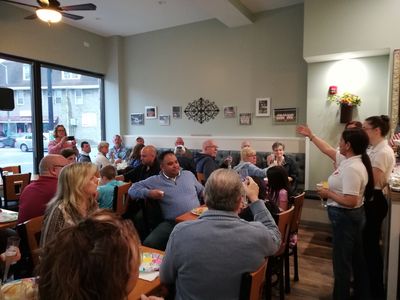 Gladys offers a toast to everyone in attendance.